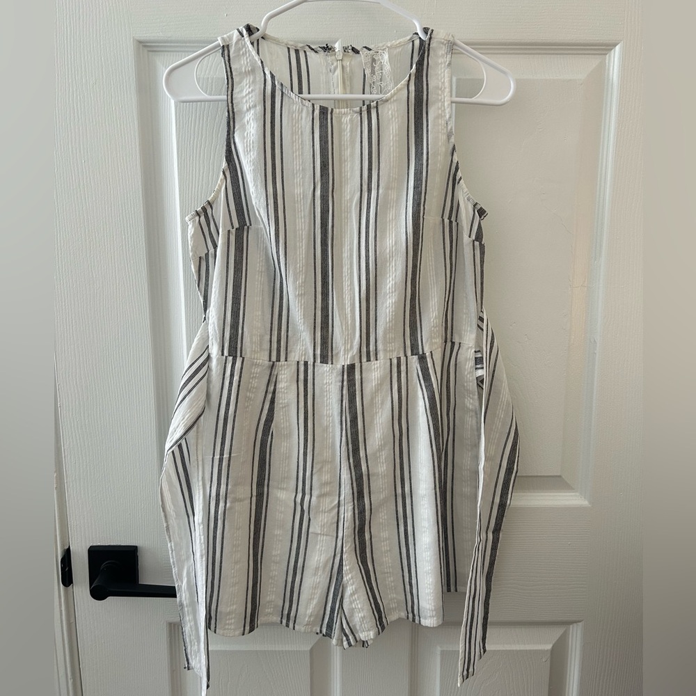 Francesca’s white striped romper. Has attached ties on the side.